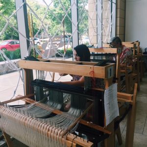Marianne Fairbanks and students weaving at looms