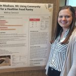 Mallory Swenson with food insecurity poster