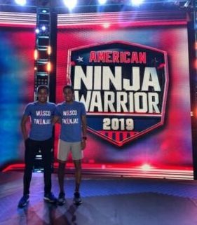 The twins pose together on the American Ninja Warrior stage