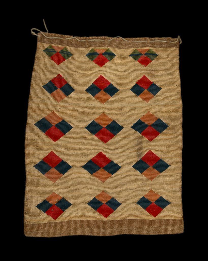 red patterned side of cornhusk bag