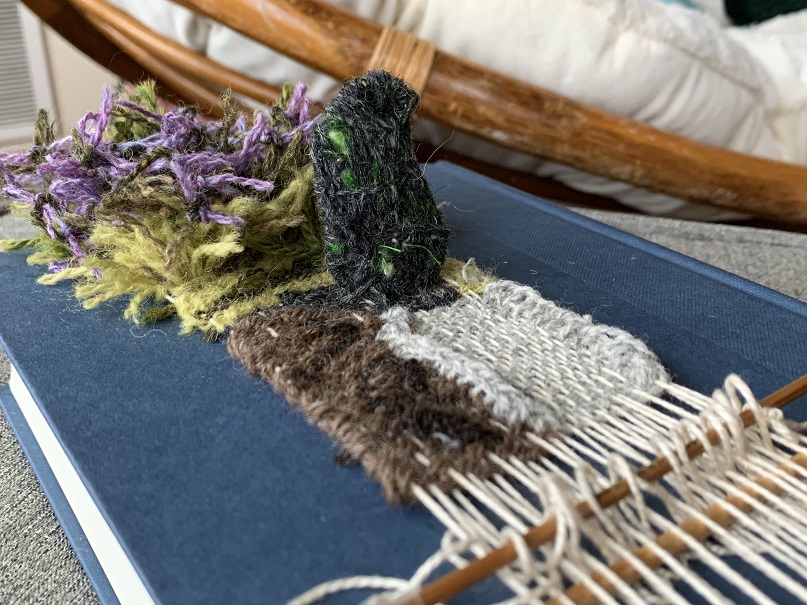 Kristen Wold 3 Book Weaving purple, green, white, and brown weaving over blue hardcover Outlander