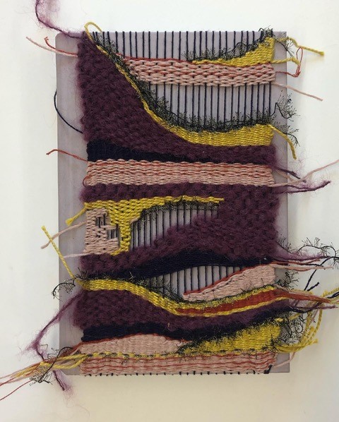 dark purple, yellow, pink, etc. weaving over light pink book cover
