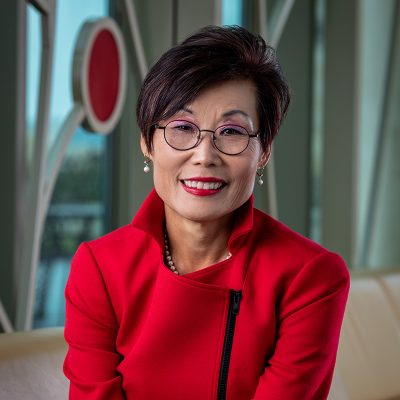 Dean Soyeon Shim in front of 100 Women Wall.