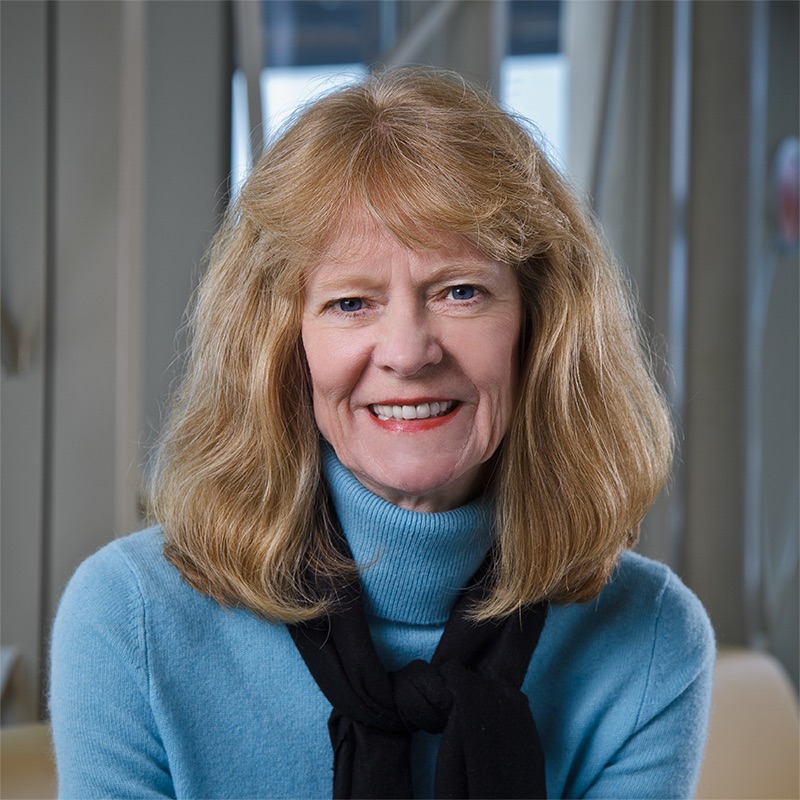 Professional photo of Wendy Way in front of 100 Women Wall.