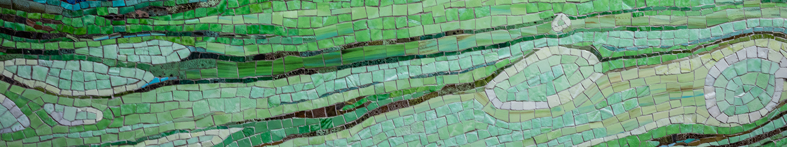 A closeup of 'Threshold' a green, tile mosaic created by Lynn Basa, located in the main entrance to Nancy Nicholas Hall.