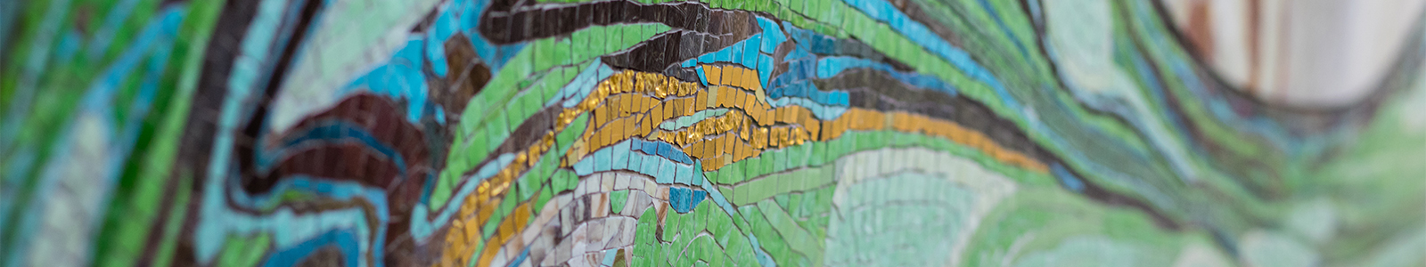 A closeup of 'Threshold' a green, tile mosaic created by Lynn Basa, located in the main entrance to Nancy Nicholas Hall.