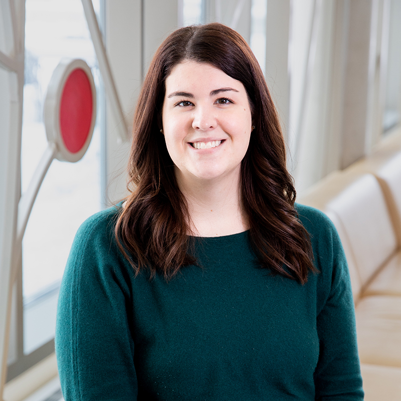 Professional photo of Michelle Hamilton in front of 100 Women Wall.