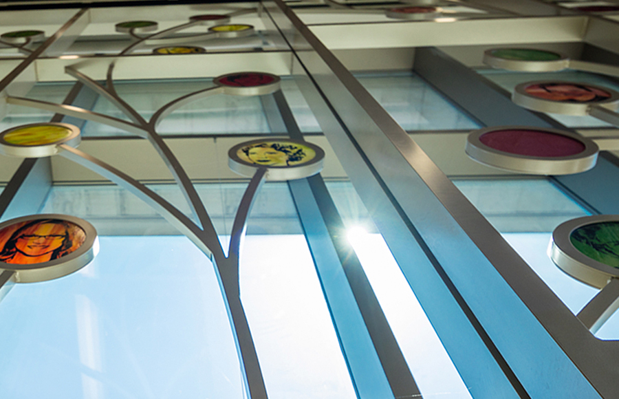 Close-up, looking upward at the 100 Women Wall at the School of Human Ecology.