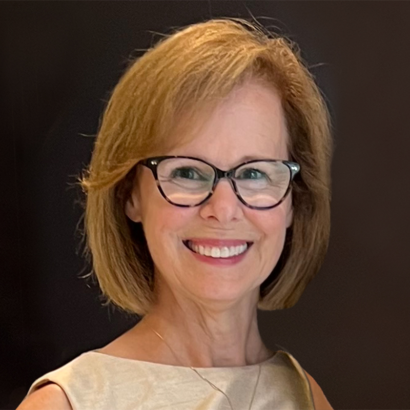 A petite brunette grandmother with glasses.