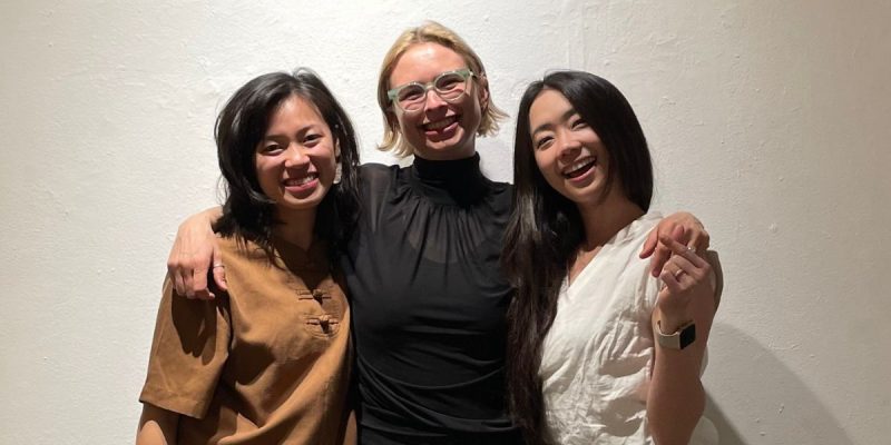 Veronica Y. Pham, Heather Kohlmeier and Esther Cho pose together with big smiles and arms around each other.