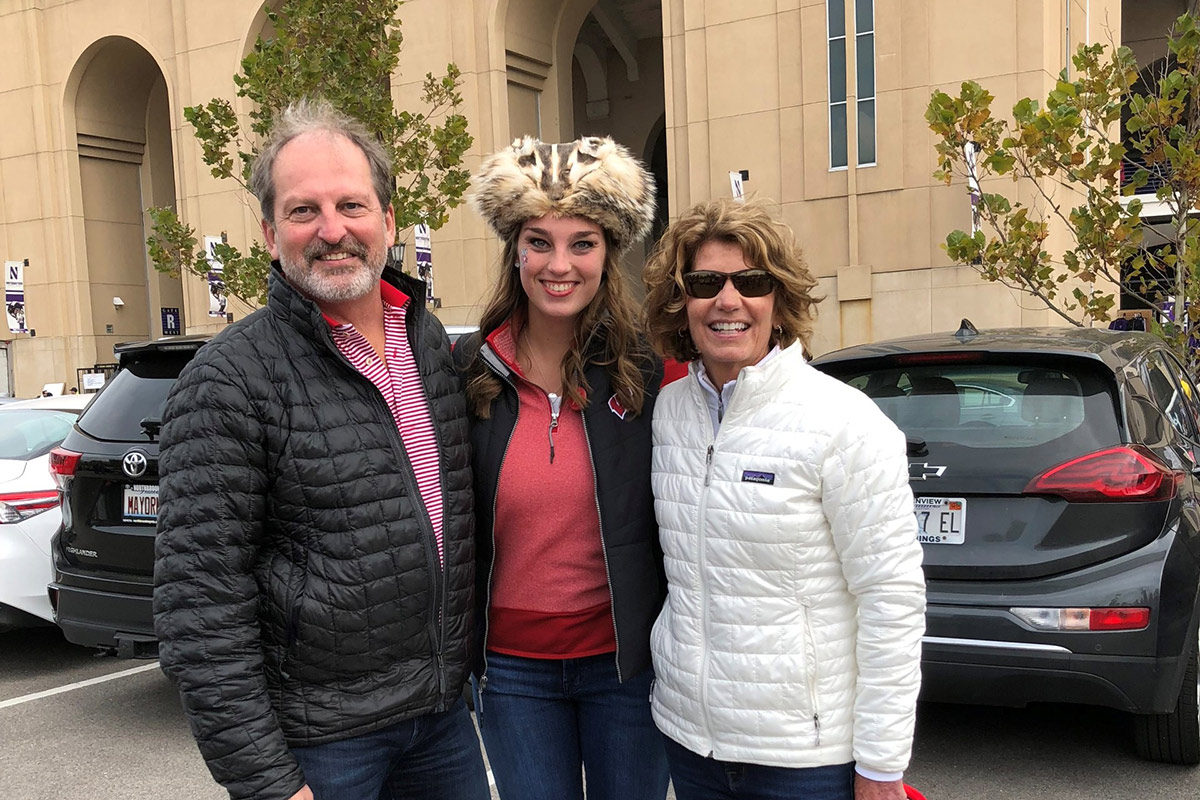 A family photo of Carl, Sara and Mary Strohmaier in front of Camp Randall