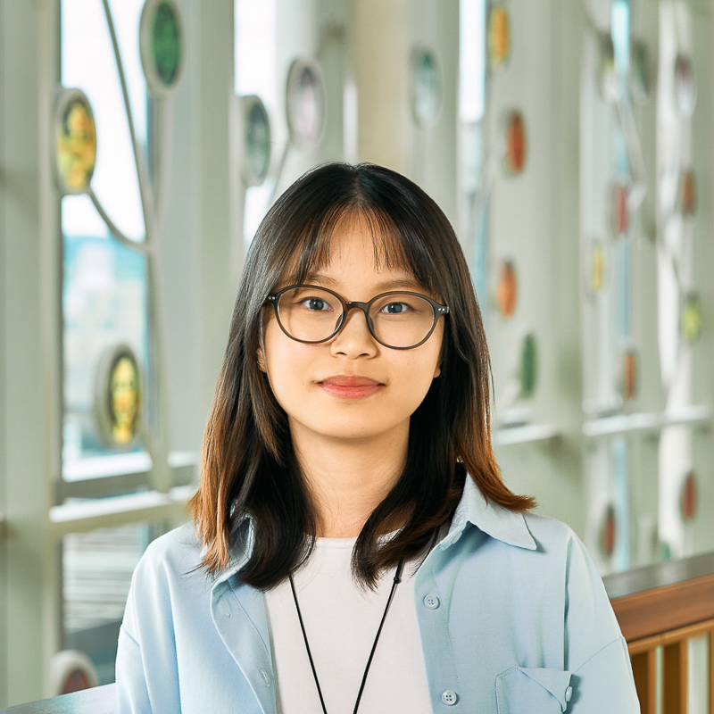 An Asian girl smiling.